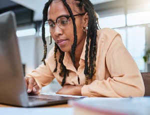 woman, laptop and focus reading conversation, web management